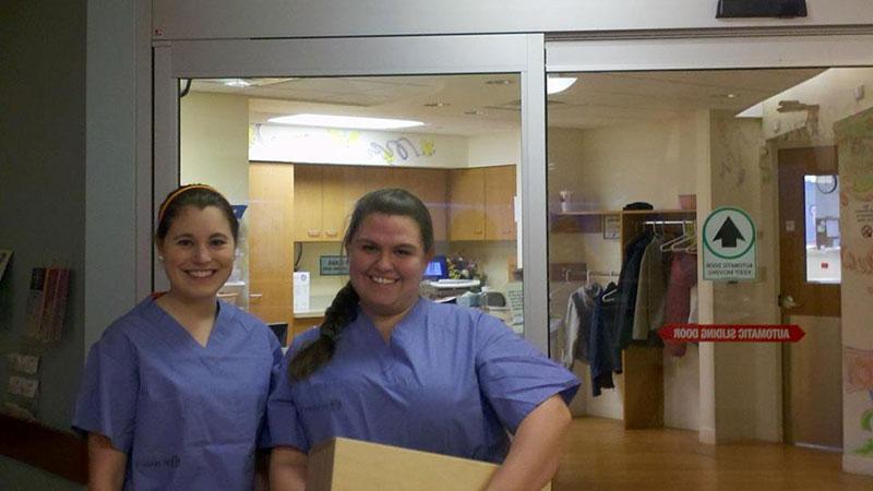 Two happy nurses in a hospital